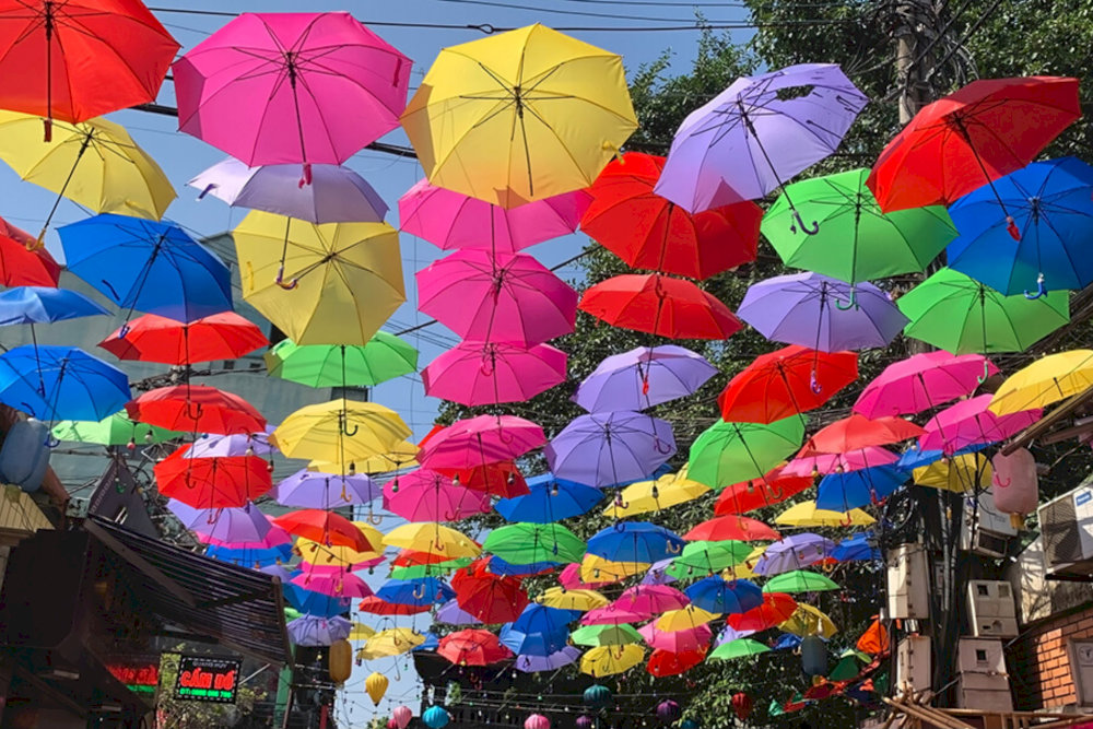 Visitors can explore traditional silk shops and immerse themselves in the village's rich culture